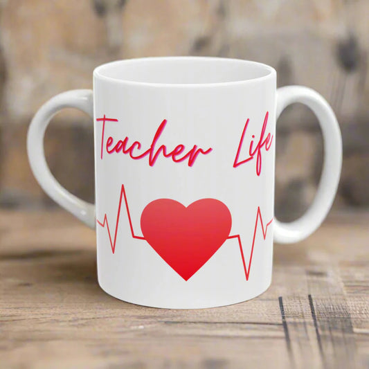 White mug with red heart and 'Teacher Life' text on a white background